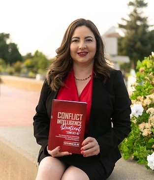 Yvette Durazo with her book Conflict IQ.